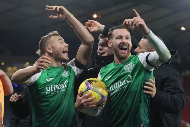 Hibs' Martin Boyle celebrates his hat-trick with the matchball and Ryan Porteous (left) during the Premier Sports Cup semi-final between Rangers and Hibernian at Hampden. (Photo by Alan Harvey / SNS Group)