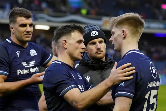 Ben White consoles Harry Paterson, far right, who made his debut for Scotland.