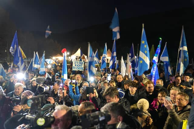 People attending a rally outside the Scottish Parliament in Edinburgh, as the SNP has announced new plans to introduce a bill to allow Scotland to decide on independence.