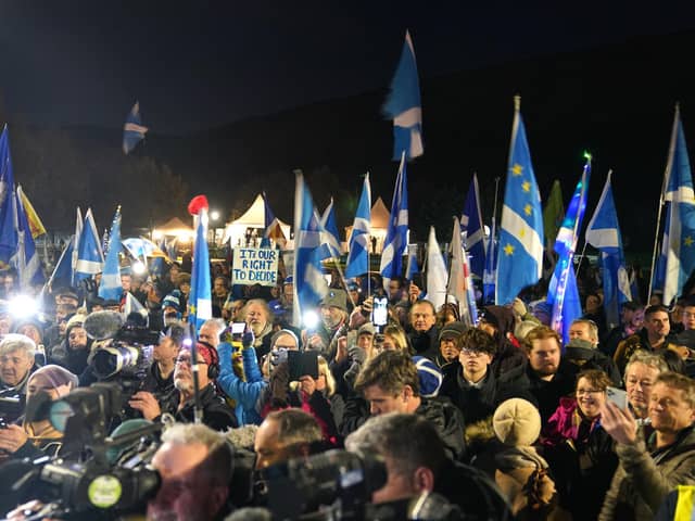 People attending a rally outside the Scottish Parliament in Edinburgh, as the SNP has announced new plans to introduce a bill to allow Scotland to decide on independence.