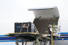 Yang Guang and Tian Tian are loaded onto  a China Southern cargo plane at Edinburgh Airport. Photo: Jane Barlow/PA Wire