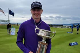 Royal Burgess member Cameron Adam shows off the Scottish Amateur Championship trophy after his impressive title triumph at Royal Dornoch.