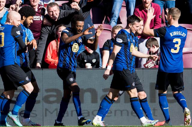 Hearts' Beni Baningime (C) celebrates scoring the opener v Livingston. He was later forced off with a knee injury (Photo by Ross Parker / SNS Group)