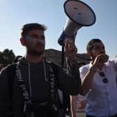Armenians protest to urge the government to respond to the Azerbaijani military operation launched against the breakaway Nagorno-Karabakh region outside the government building in central Yerevan.