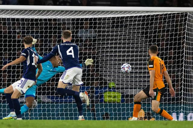 Jack Hendry glances home Scotland's equaliser at Hampden.