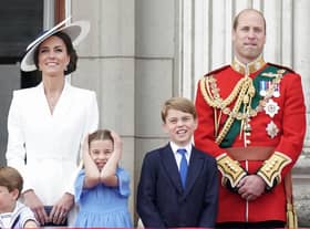 Prince Louis of Cambridge, Catherine, Duchess of Cambridge, Princess Charlotte of Cambridge, Prince George of Cambridge and Prince William, Duke of Cambridge watch the RAF flypast on the balcony of Buckingham Palace during the Trooping the Colour parade on June 02, 2022 in London, England. WPA Pool/Getty Images)