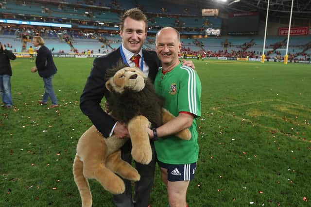 Stuart Hogg, holding tour mascot BIL, celebrates with team doctor James Robson after the Lions' Test win over the Wallabies in Sydney. Picture: David Rogers/Getty Images