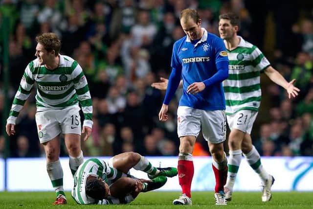 Rangers' Steven Whittaker is sent off after receiving his second yellow card for a foul on grounded Celtic full-back Emilio Izaguirre. (Photo by Craig Williamson/SNS Group).