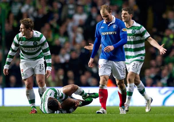 Rangers' Steven Whittaker is sent off after receiving his second yellow card for a foul on grounded Celtic full-back Emilio Izaguirre. (Photo by Craig Williamson/SNS Group).