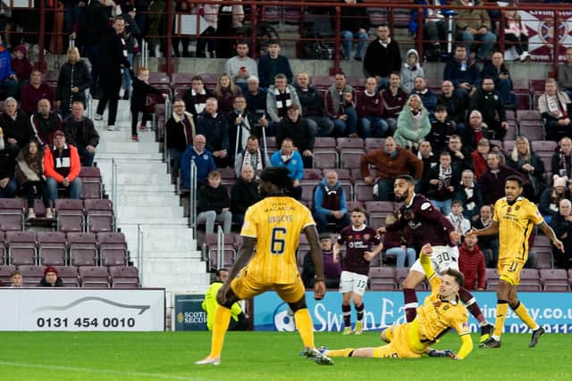 Hearts' Josh Ginnelly scored deep into stoppage time to rescue a point against Livingston.