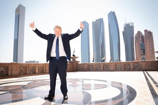 Prime Minister Boris Johnson arrives for a media interview at the Emirates Palace hotel in Abu Dhabi during his visit to the United Arab Emirates (UAE).