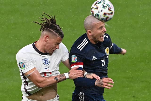 Lyndon Dykes of Scotland competes for a header with Kalvin Phillips of England during the UEFA Euro 2020 Championship Group D match between England and Scotland at Wembley Stadium on June 18, 2021 in London, England. (Photo by Facundo Arrizabalaga - Pool/Getty Images)