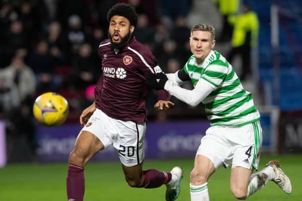 Hearts' Ellis Simms and Celtic's Carl Starfelt during a cinch Premiership match between Hearts and Celtic at Tynecastle. (Photo by Ross Parker / SNS Group)