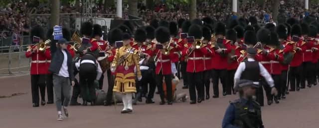 The band had to walk round the disruption as police charged in.