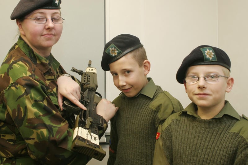 Nathan Dovinson and Ben Parker, with  Barbara Scullion, check out the equipment at the opening of an Army cadet centre at Clay Cross in 2006.