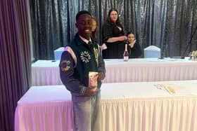 Joel posing with his certificate  - so deserved.