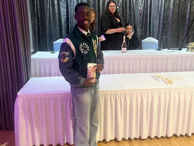 Joel posing with his certificate - so deserved.