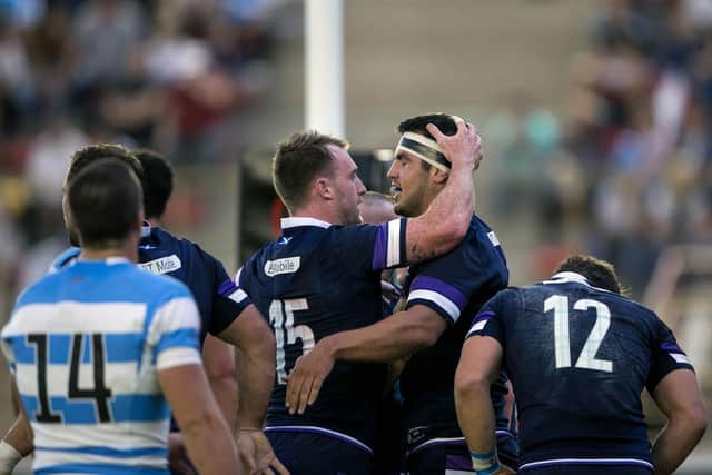 Stuart Hogg and Stuart McInally celebrate a try for Scotland against Argentina, in Resistencia in 2018. (Photo by Pablo GASPARINI / AFP)