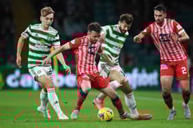 Raith's Aidan Connolly (centre) holds off Celtic's Albian Ajeti during a Premier Sports Cup quarter final match between Celtic and Raith Rovers at Celtic Park, on September 23, 2021, in Glasgow, Scotland.  (Photo by Ross MacDonald / SNS Group)