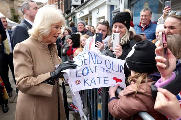 Queen Camilla receives a message of support for the Princess of Wales from well-wishers during a visit to the Farmers' Market in The Square, Shrewsbury. Photo: Chris Jackson/PA Wire