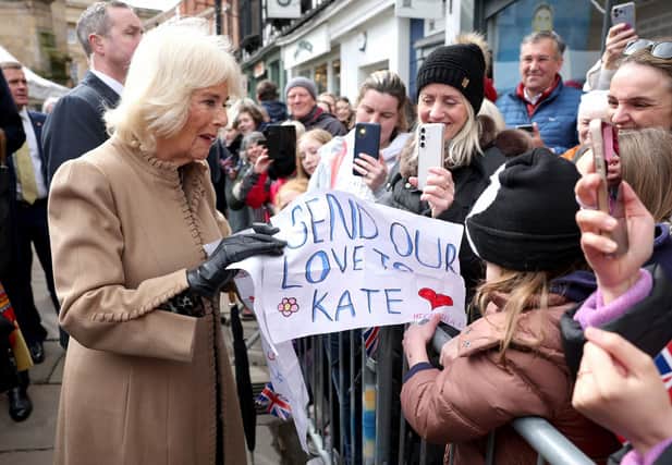 Queen Camilla receives a message of support for the Princess of Wales from well-wishers during a visit to the Farmers' Market in The Square, Shrewsbury. Photo: Chris Jackson/PA Wire