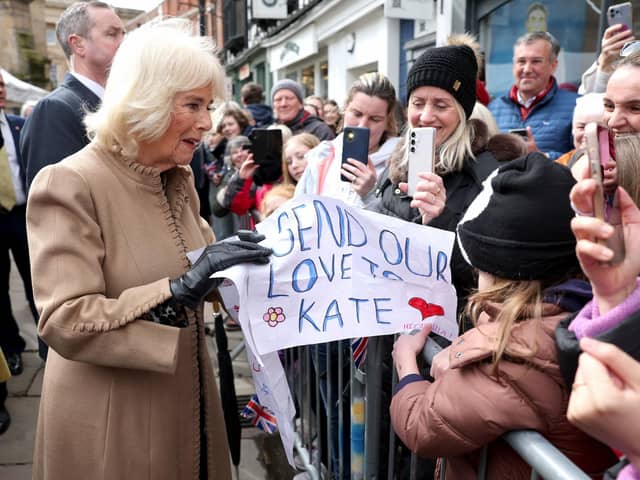 Queen Camilla receives a message of support for the Princess of Wales from well-wishers during a visit to the Farmers' Market in The Square, Shrewsbury. Photo: Chris Jackson/PA Wire