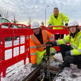 Robert Thorburn (centre) watches engineers Lucy Kennedy and Jodine Crombie as they work on Scotland’s new full fibre network