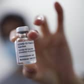 File photo dated 04/02/21 of a vial of the Oxford/AstraZeneca coronavirus vaccine. UK leaders and medical experts have defended the use of the AstraZeneca vaccine despite multiple European countries pausing its use due to concerns over possible adverse side effects. Issue date: Tuesday March 16, 2021.