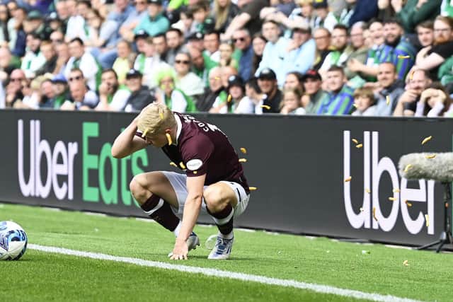 Alex Cochrane of Hearts is hit by objects thrown from the Hibs support during the Edinburgh derby at Easter Road.  (Photo by Rob Casey / SNS Group)