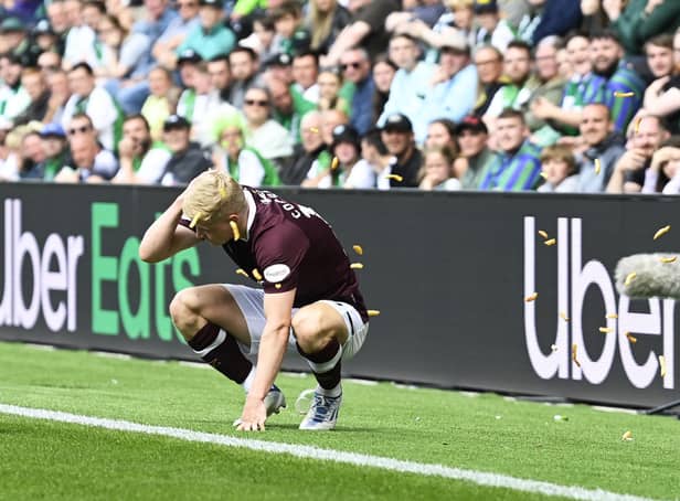 Alex Cochrane of Hearts is hit by objects thrown from the Hibs support during the Edinburgh derby at Easter Road.  (Photo by Rob Casey / SNS Group)
