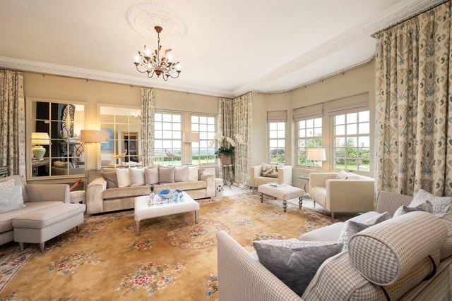 Interior: A welcoming reception hall leads to a large bay-windowed lounge/family room to the front of the ground floor. At the rear is a formal dining room and traditional kitchen. The four bedrooms are upstairs, the principal providing a dressing area.