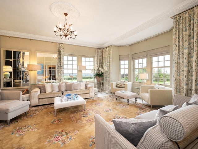 Interior: A welcoming reception hall leads to a large bay-windowed lounge/family room to the front of the ground floor. At the rear is a formal dining room and traditional kitchen. The four bedrooms are upstairs, the principal providing a dressing area.
