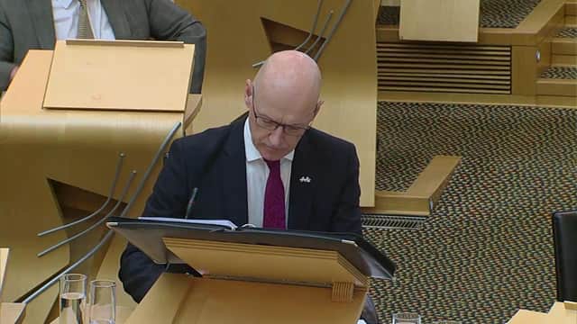 John Swinney speaking at FMQs at the Scottish Parliament on Thursday (Photo: Scottish Parliament).