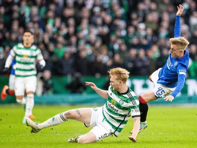 GLASGOW, SCOTLAND - DECEMBER 30: Celtic's Liam Scales tackles Rangers' Ross McCausland. he Irishman again stood up in another major occasion and says he is used to the demands required in them. (Photo by Alan Harvey / SNS Group)
