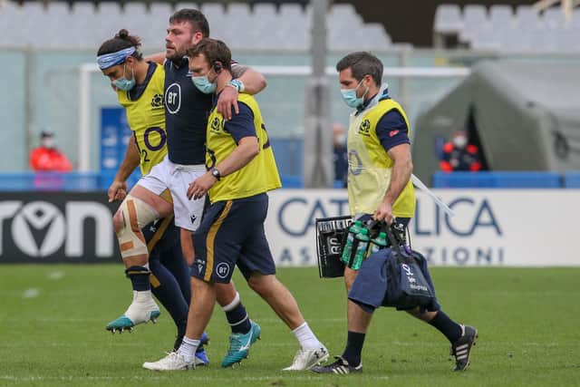 Rory Sutherland was helped from the field after injuring his ankle in the first half against Italy. Picture: Giampiero Sposito/Getty Images