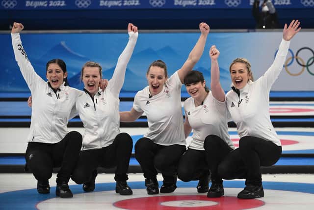 Gold medallists Britain's Eve Muirhead, Vicky Wright, Jennifer Dodds, Hailey Duff, Mili Smith pose ahead of the women's curling victory ceremony at the Beijing 2022 Winter Olympic Games at the National Aquatics Centre in Beijing on February 20, 2022. (Photo by JEFF PACHOUD/AFP via Getty Images)