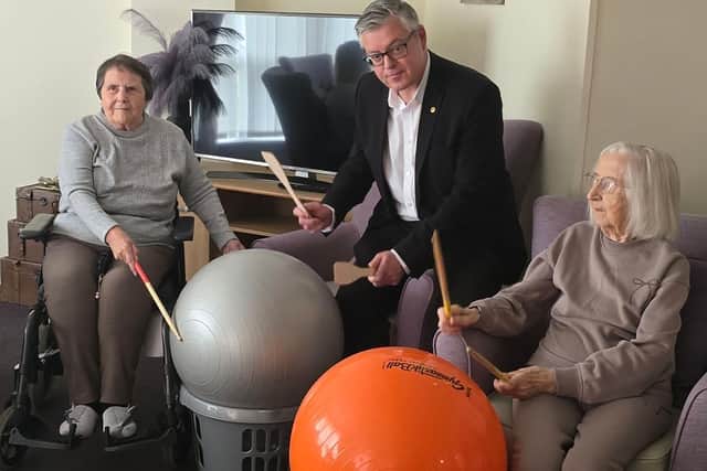 Stuart McMillan, Member of Scottish Parliament (MSP) for Greenock and Inverclyde with residents at HC-One Scotland’s Merino Court Care Home celebrating Care Home Open Week 2025