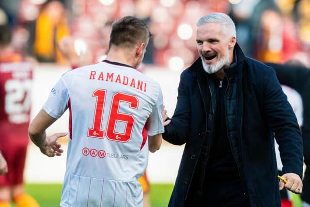 Aberdeen manager Jim Goodwin celebrates with Ylber Ramadani at full-time following the 2-1 win over Motherwell at Fir Park. (Photo by Craig Foy / SNS Group)