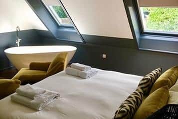 Some of the guest rooms are in a former modern private home to the back of the inn, a modern and stylish annexe where contemporary fittings and dark, moody hues create a hideaway feel.