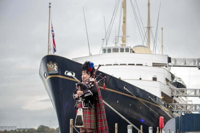 A piper plays a lament piper aboard the Royal Yacht Britannia, moored in Leith, Edinburgh, ahead of the funeral of Queen Elizabeth II.