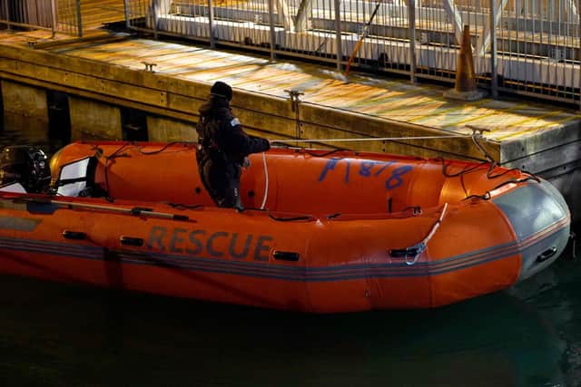 A Border Force officer secures a boat in Dover that was used by people thought to be migrants following a small boat incident in the Channel. Picture: Gareth Fuller/PA Wire