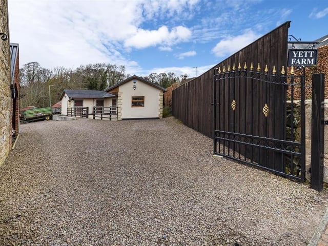 Gated entrance to rear of property.