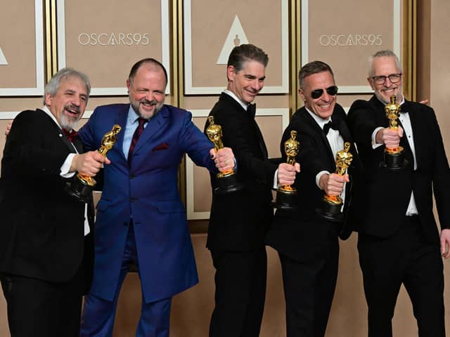 US production sound mixer Mark Wingarten, British sound editor James H Mather, US musical composer Al Nelson, British sound engineer Chris Burdon and British sound engineer Mark Taylorn were honoured with the Oscar for best sound for their work on Top Gun: Maverick. Picture: Frederic J. Brown / AFP
