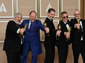 US production sound mixer Mark Wingarten, British sound editor James H Mather, US musical composer Al Nelson, British sound engineer Chris Burdon and British sound engineer Mark Taylorn were honoured with the Oscar for best sound for their work on Top Gun: Maverick. Picture: Frederic J. Brown / AFP