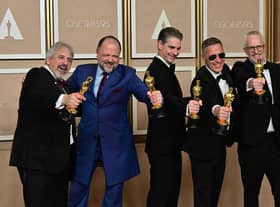 US production sound mixer Mark Wingarten, British sound editor James H Mather, US musical composer Al Nelson, British sound engineer Chris Burdon and British sound engineer Mark Taylorn were honoured with the Oscar for best sound for their work on Top Gun: Maverick. Picture: Frederic J. Brown / AFP