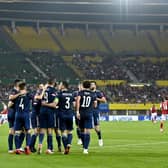 Scotland celebrate after Lyndon Dykes netted from the penalty spot in Vienna.