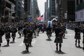 Bagpipers march along Sixth Avenue during a previous Tartan Day Parade in New York City (Picture: Eduardo Munoz Alvarez/Getty Images)