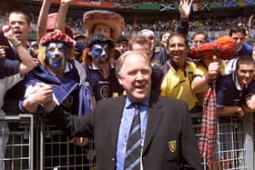 Scotish coach Craig Brown salutes Scotish supporters 10 June at the Stade de France in Saint Denis before the opening ceremony of the 1998 Soccer World Cup between Brazil and Scotland.  (Photo by TOSHIFUMI KITAMURA/AFP via Getty Images)