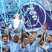 Manchester City captain Fernandinho lifts the Premier League trophy after the 3-2 win over Aston Villa on the final day of the Premier League season. (Photo by Stu Forster/Getty Images)