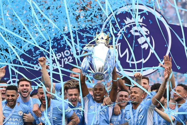 Manchester City captain Fernandinho lifts the Premier League trophy after the 3-2 win over Aston Villa on the final day of the Premier League season. (Photo by Stu Forster/Getty Images)